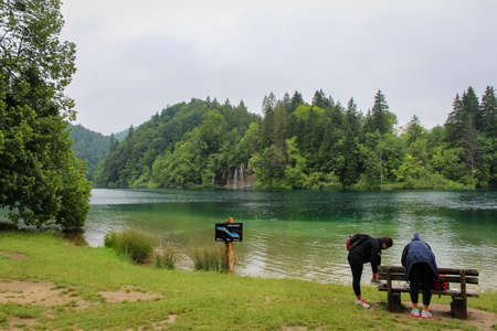 Tourists at Lake Kozjak, Plitvice Lakes, UNESCO World Heritage Site, Croatia, on a summers dayのeditorial素材