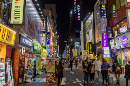 Seoul, South Korea - October 19th 2017: Myeongdong Shopping District at night in Seoul, South Korea