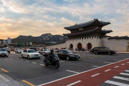 Seoul, South Korea - October 19th 2017: Gwanghwamun Gate at Gyeongbokgung Palace at sunset, by the traffic at sajik-ro, Seoul, South Koreaのeditorial素材