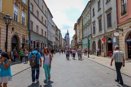 Krakow, Poland - July 29th 2018: Tourists walking down Florianska street in the old town of Krakow, Poland, near St.Florian's Gateのeditorial素材