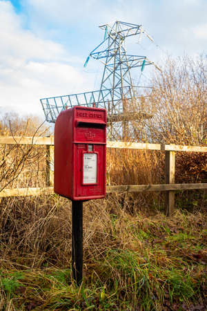 Glenlee, Scotland - December â24, â2020: Red British Lamp Post Box in a rural setting in Scotlandのeditorial素材