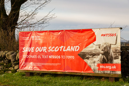 Castle Douglas, Scotland - 27th December 2020: Close up of the Save our Scotland, National Trust for Scotland campaign banner at Threave Castle, Castle Douglasのeditorial素材