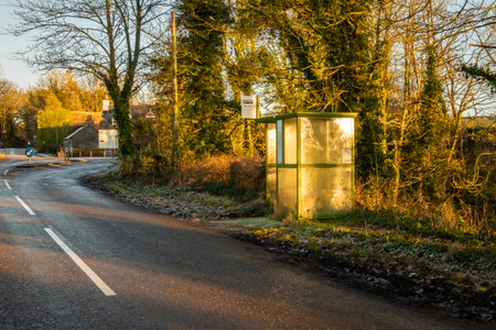 A rural bus stop in the winter sun at Tongland Bridge, Kirkcudbright, Scotlandの写真素材