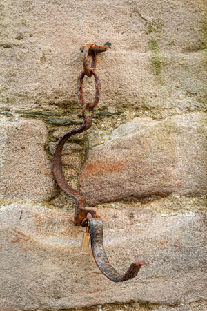 Metal collar chain for prisoners attached to a stone wall at the tolbooth in Kirkcudbright, Dumfries...