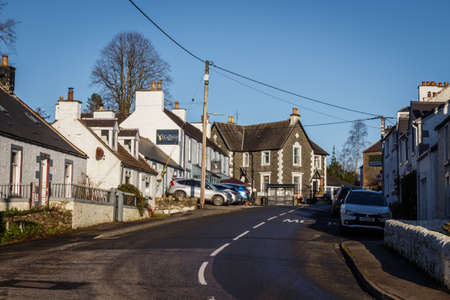 Dalry, Scotland - December 24th 2020: The main street on the A713 Ayr Road in St. John's Town of Dalry, Dumfries and Galloway, Scotlandのeditorial素材
