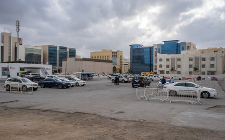 Doha, Qatar - January 16th 2022: A car park in Al Sadd beside the C ring road metro station at...
