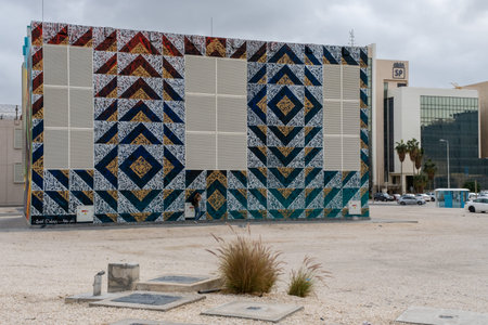 Doha, Qatar - January 16th 2022: A mural or street art on the metro buildings along the C Ring Road,...