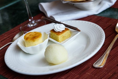 Indian desserts rossogolla, barfi and caramel custard