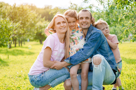 Portrait of young happy family at outdoorsの写真素材