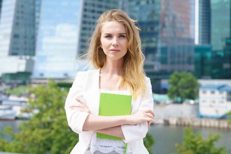 Portrait of smiling beautiful business girl smiling at camera.の写真素材