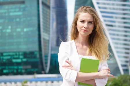 Portrait of smiling beautiful business girl smiling at camera.の写真素材