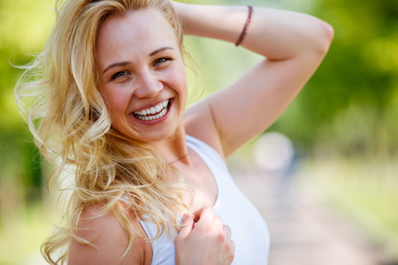 Closeup portrait of beautiful young happy smiling womanの写真素材