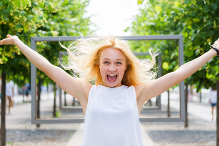 Caucasian girl having fun on park, live real emotions