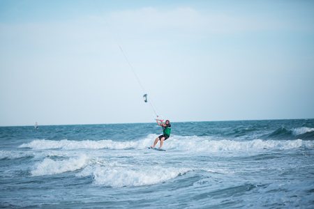 Russia. Crimea. Kerch. Kitesurfer. 09/20/2016 Kitesurfer on board over Azov sea waveのeditorial素材