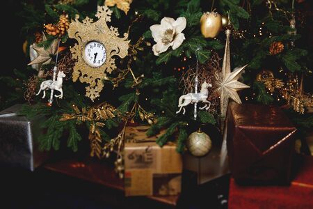 Christmas photo of tree with vintage toys, clock and giftsの写真素材
