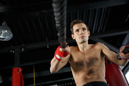 Young man in sports hallの写真素材