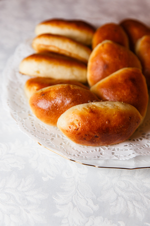 Homemade pies on white platterの写真素材