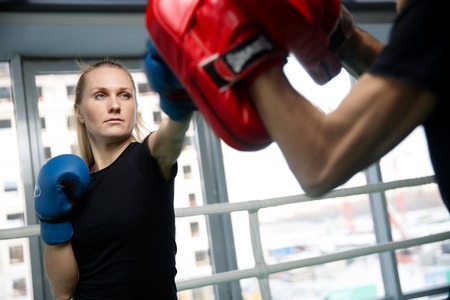 Young woman engaged in boxingの写真素材
