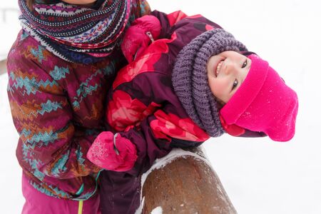 Winter walk girl with daughterの写真素材