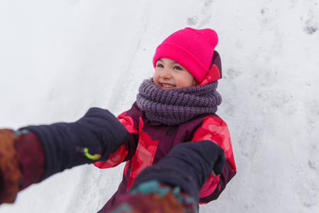Young mother playing with daughterの写真素材