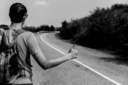 Black-white photo man on roadの写真素材