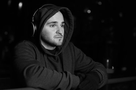 Athlete with headphones in streetの写真素材