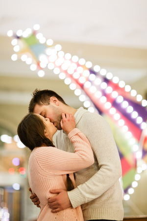 Loving couple kissing in shopの写真素材
