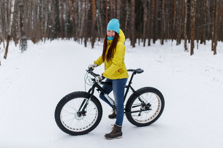 Young girl at winter cyclingの写真素材