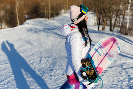 Photography of brunette with snowboardの写真素材