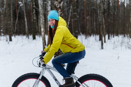 Young brunette on sports bikeの写真素材