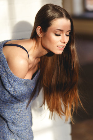 Beautiful girl in blue knitted sweater