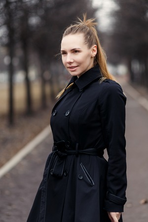 Beautiful Girl in a Black Cloakの写真素材