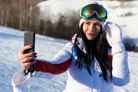 Girl doing selfie on winterの写真素材
