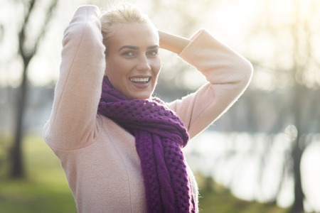 Happy woman at spring parkの写真素材