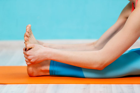 Woman doing yoga on rug