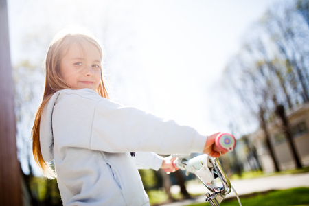 Photo of girl with bicycleの写真素材
