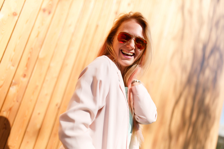 Smiling young blonde in sunglassesの写真素材