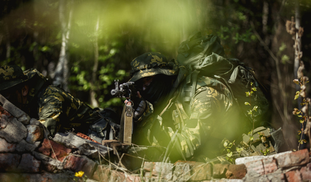 Military men with submachine gunの写真素材