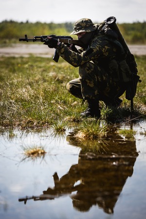 Photo of man with gunの写真素材