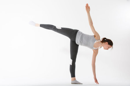 Young woman exercise yoga supported headstand