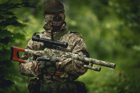 Strikeball player in camouflage,helmetの写真素材