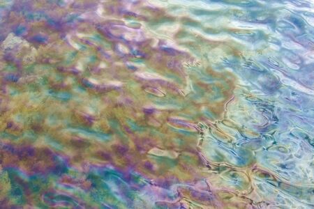 Rainbow water with ripples.の写真素材