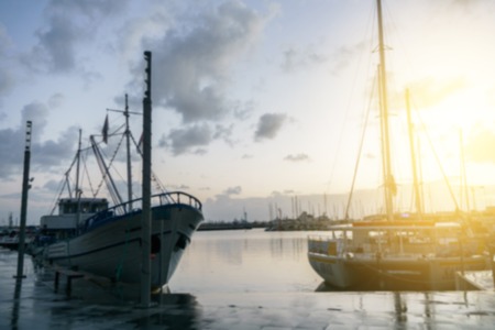 Yachts in coastal zone, cloudy sky at sunsetの写真素材