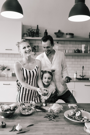 Image of beautiful couple in love preparing breakfastの写真素材