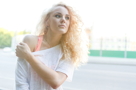 Photo of young curly blonde outdoorsの写真素材