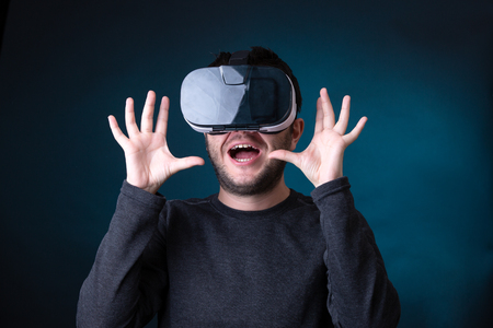 Image of surprised man in virtual reality glassesの写真素材