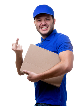 Image of young man in blue T-shirt and baseball cap with cardboard boxの写真素材