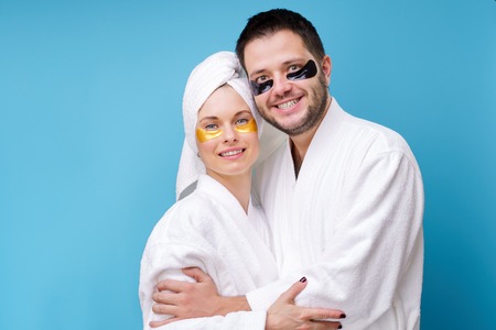 Photo of man and woman with gel pads under eyesの写真素材