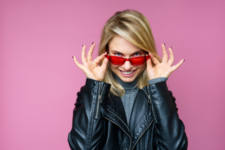 Photo of blonde in pink glassesの写真素材