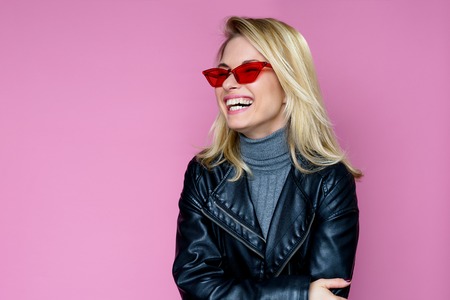 Photo of happy blonde in pink glassesの写真素材